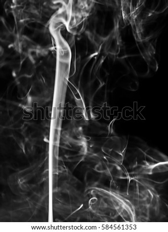 Smoke. White smoke swirls over black background. Abstract smoke on black background