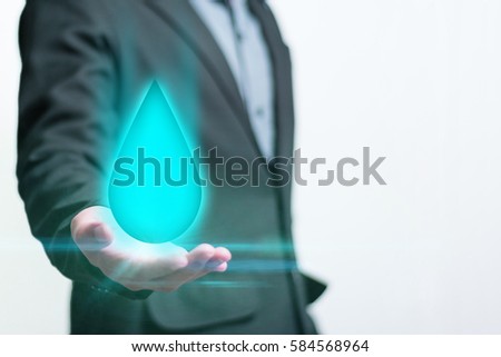 Businessman holding a smart hologram technology of water in world water day