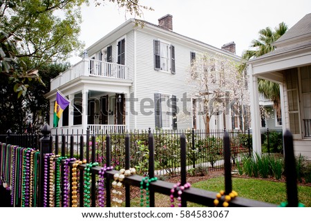 Mardi gras beads and decorations in the garden district of New Orleans Louisiana 