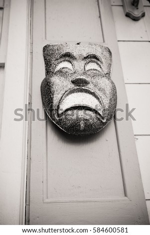 black and white picture of a mardi gras mask in the French Quarter of New Orleans Louisiana