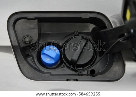 Adblue Diesel exhaust fluid fuel tank cap Royalty-Free Stock Photo #584659255