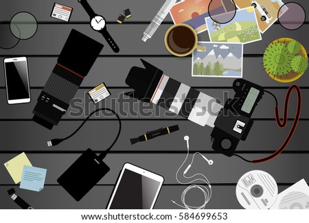 Workspace of photographer. Top view with gray table, photo camera, lens, smartphone, tablet and coffee cup. Flat design. Vector illustration with clipping mask.
