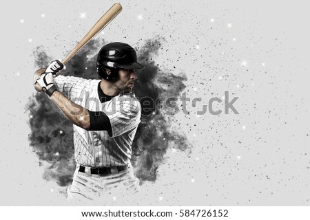 Baseball Player with a white uniform coming out of a blast of smoke .