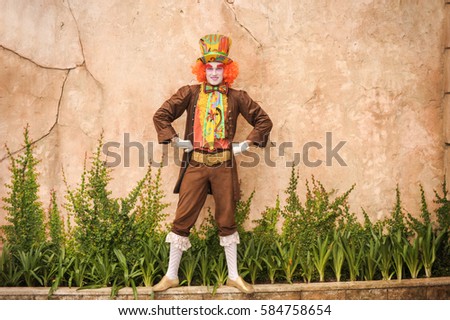 A positive and joyful Hatter isolated on white background