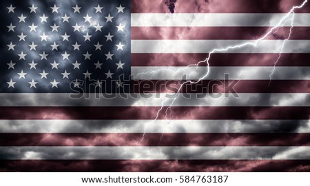American flag against dark sky, clouds and lightning