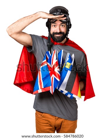 Superhero with a lot of flags showing something
