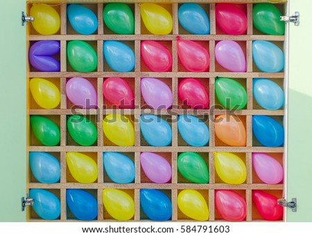 Multi-colored balloons in the cells.