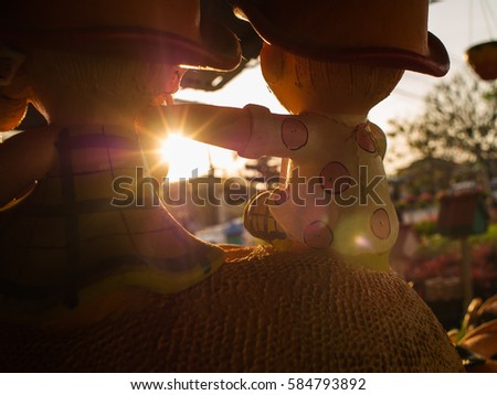 Sun Light Through The Boy Doll who Put His Hand in Shoulder Doll Girl