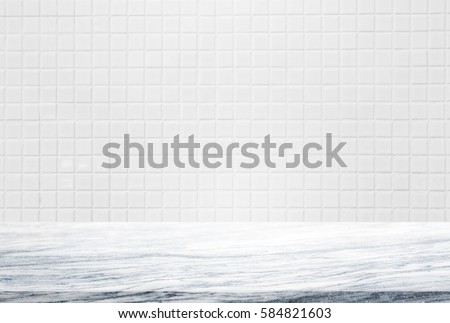 Stone table top and background of white ceramic tile wall - can used for display or montage your products.