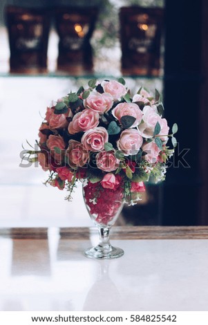 Colorful decoration artificial flower in the vase at home, on table ,Thailand,vintage picture style