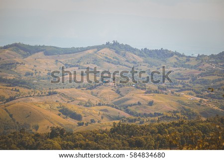 View over a valley from the top of a hill