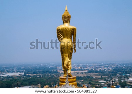 Buddha sculpture standing on a mountain at Wat Phra That Khao Noi (Temple), Nan Province, Thailand