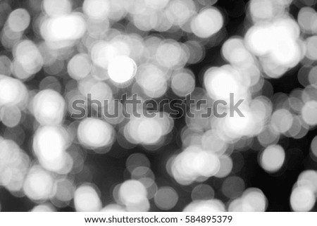 Dark or black abstract blurred circle bokeh for Christmas night light holiday background and design, defocused