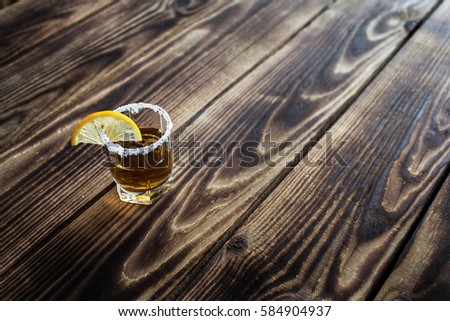 the alcohol shot drink with lemon and salt Royalty-Free Stock Photo #584904937
