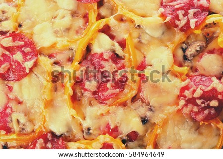 Close up view of tasty pizza with pepperoni, cheese, mushrooms and salad pepper