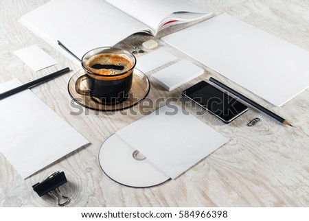 Photo of blank stationery on light wooden table background. Corporate identity template for placing your design. Branding ID mockup.