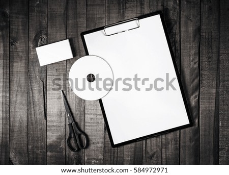 Photo of blank stationery set. ID template. Branding identity template on vintage wooden table background. Mock up for placing your design. Top view.