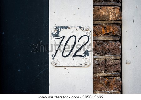 House number one hundred and two  (102) .