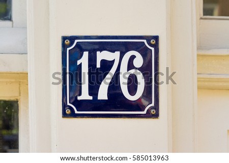 Enameled house number one hundred and seventy six (176).