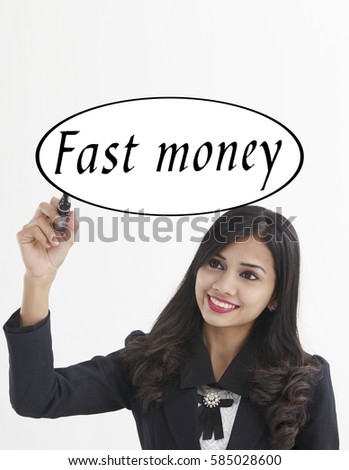 businesswoman holding a marker pen writing -fast money