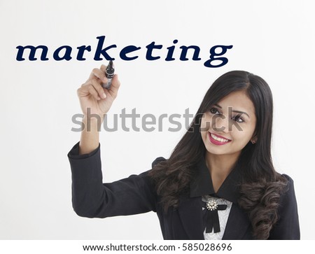 businesswoman holding a marker pen writing -marketing