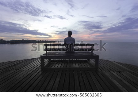 Man sitting on the chair are saddened and frustrated with life./made picture to the concept