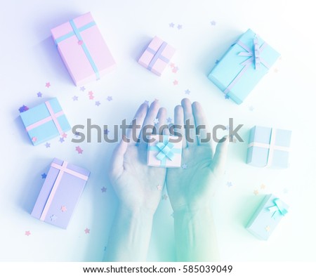 A present and a hands with happiness.