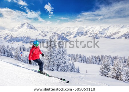 Trees covered by fresh snow in Austria Alps from Kitzbuehel ski resort - one of the best ski resort in the workd with 54 cable cars, 170 km prepared skiing slopes and place of famous hahnenkamm races. Royalty-Free Stock Photo #585063118