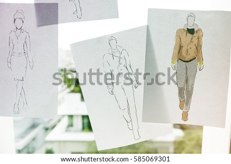 Fashion design sketching paper on the window wall