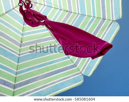 Swimsuit drying under parasol
