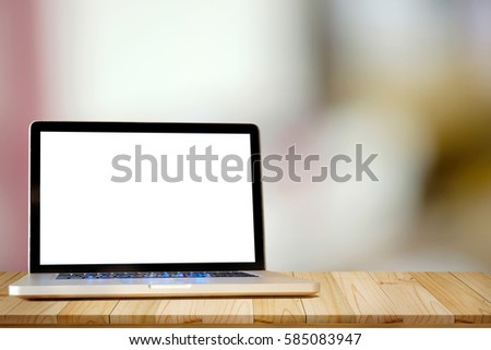  Mock up Laptop on Wood table with blurred background.
