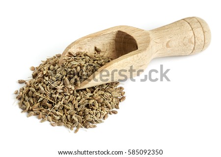 Pile of of dried anise seed (aniseed) with wooden scoop isolated on white background Royalty-Free Stock Photo #585092350