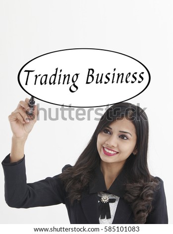 businesswoman holding a marker pen writing -trading business