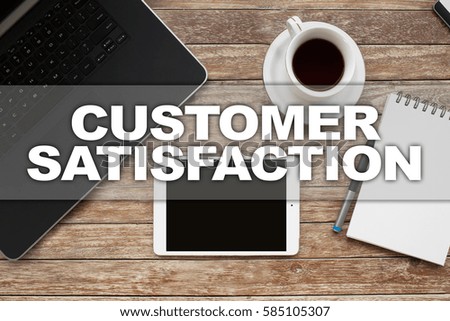 Tablet on desktop with customer satisfaction text.