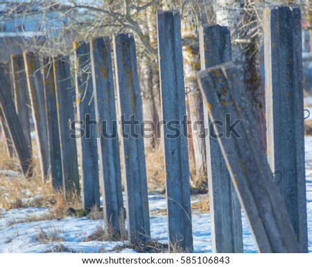 concrete posts with snow in the winter