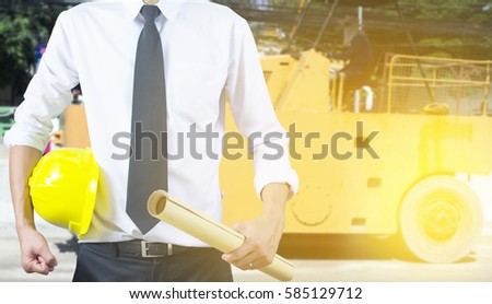 Engineer yellow helmet for the safety of workers on the background of Onshore drilling rig sites for banner.