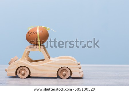 Happy Easter concept card. Wooden toy car. delivering Easter eggs. 