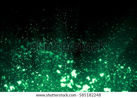 Isolated green  Bokeh or round defocused particles or glitter lights background