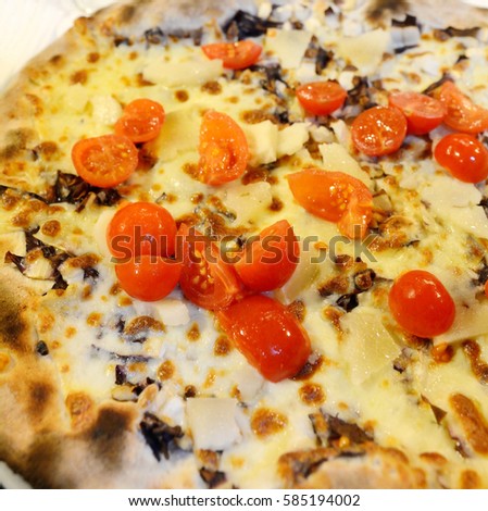 Italian pizza with mozzarella tomato and truffle
