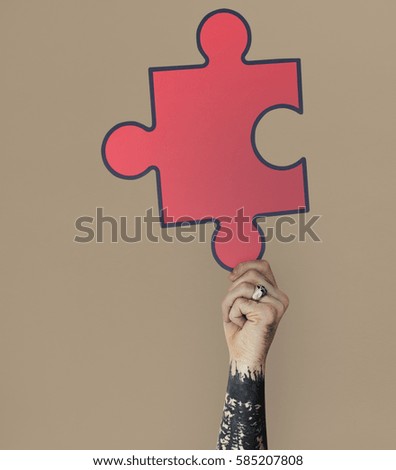 Human Hand Holding Jigsaw Puzzle