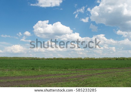 Spring photo of cloudy sky over the field road. Russia. Penza region.