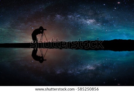 Landscape with Milky way galaxy. Night sky with stars and silhouette Photographer take photo on the mountain.
