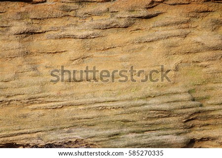 Weathered Stone Wall In Shades of Ochre and Grey.