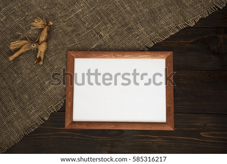 Frame on a wooden background with a toy.