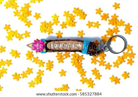 isolated pencil keychain with wording