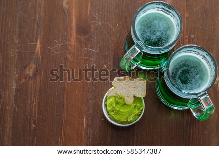St Patrick day party - green beer and appetizers, copy space