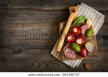 The Ultimate Appetizer Board with cheese, vegetables and meat.