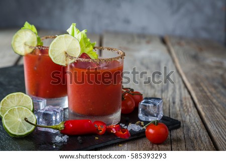 Bloody mary cocktail and ingredients, copy space Royalty-Free Stock Photo #585393293