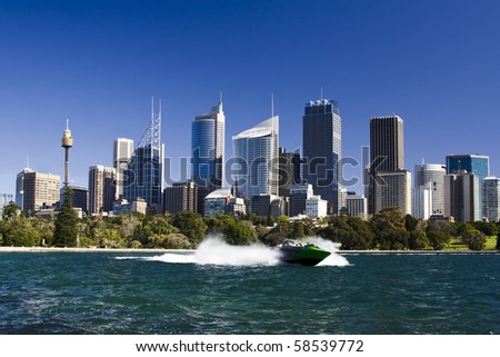 sydney australia city central business district view from royal botanic garden over bay blue skyline jet boat