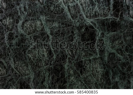 Background wall of flat of polished natural marble. Unusual texture, beautiful deep stains of different layers on background of black marble slabs. Background luxury and wealth of interior decoration